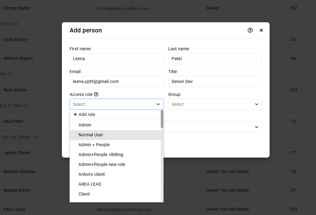 How do I invite team members and assign roles in ProofHub? 3